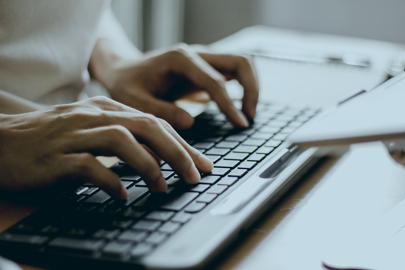 Male Hands Typing on a Wireless Computer Keyboard